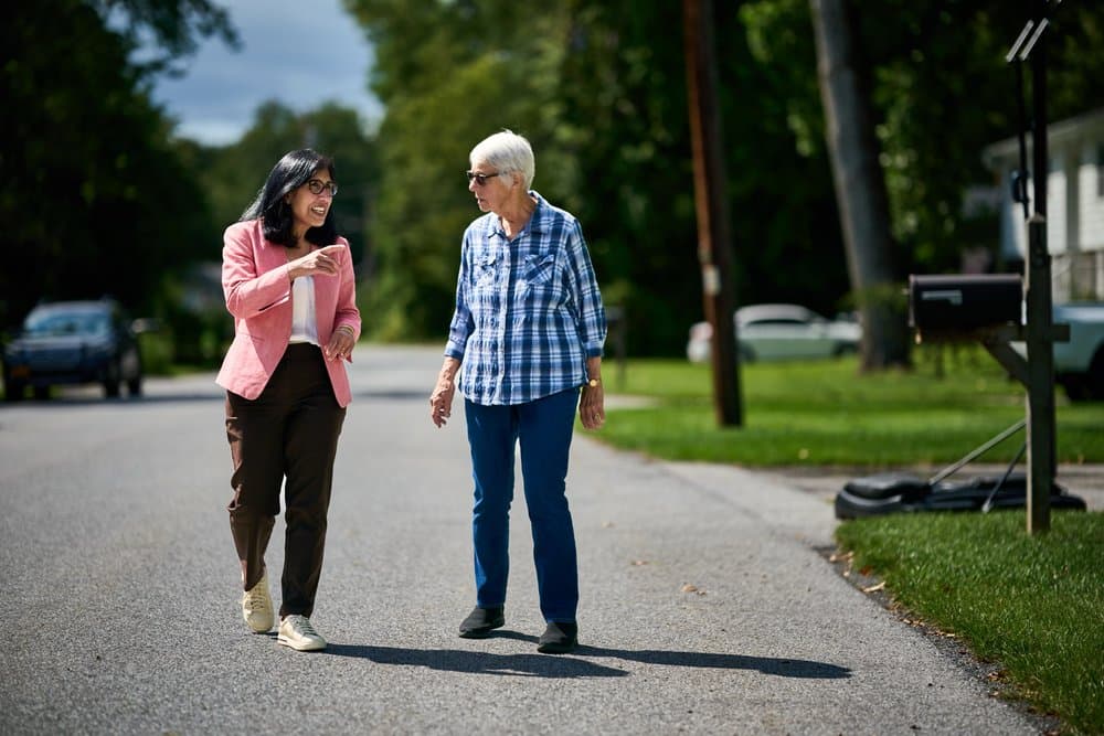 Lisa Kaul — walking with a resident